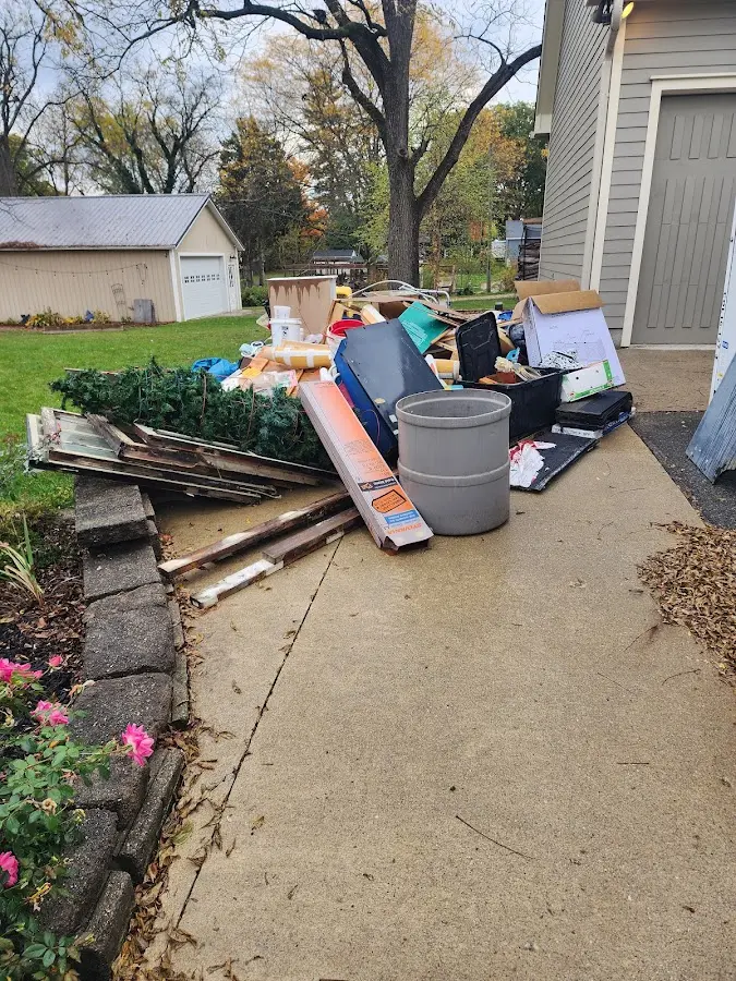 Dumpster being loaded with debris for 3 Yard Dumpster Rental in Waikapu